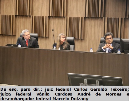 foto vertical mesa com três pessoas uma mulher e dois homens. juiz Carlos Geraldo juiz federal Vânia Cardoso desembargador Marcelo Dolzany